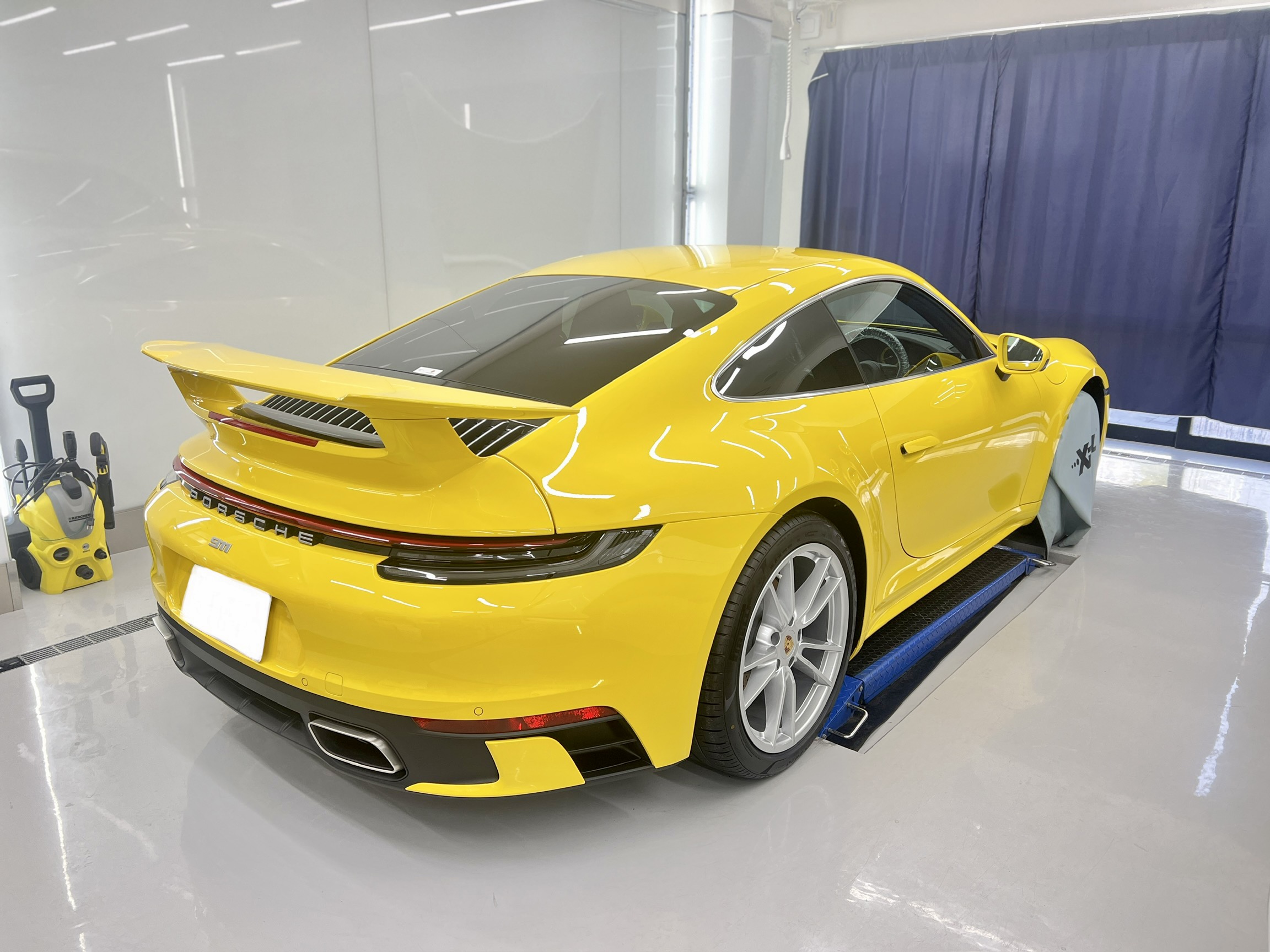 911 carrera racing yellow rear